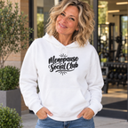 Blonde woman in her 50s wearing the embroidered Menopause Social Club white hoodie, front view