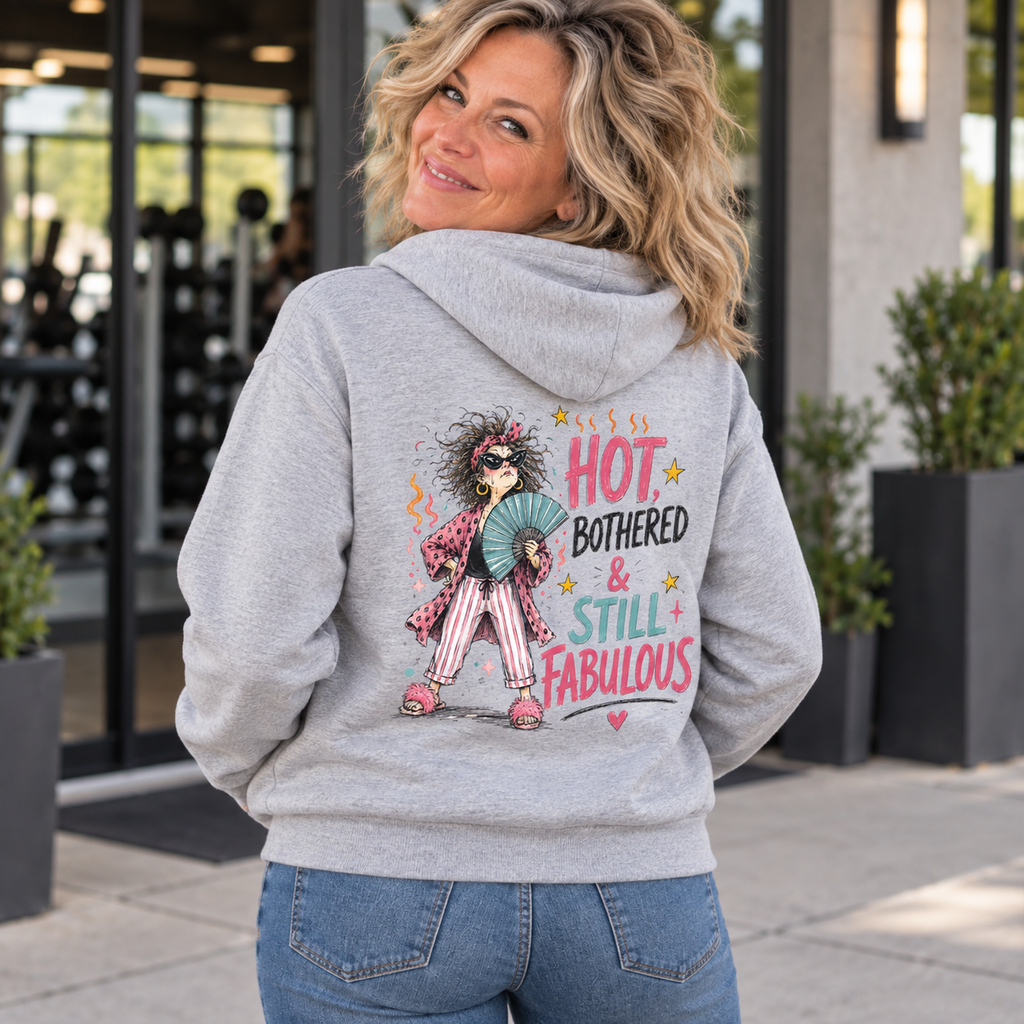 Blonde woman in her 50s wearing the Hot Bothered and Still Fabulous grey hoodie, back view