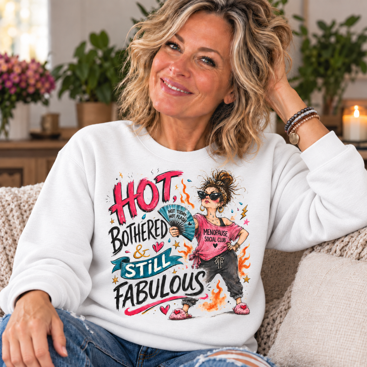 White — blonde woman in her 50s wearing Hot Bothered and Still Fabulous sweatshirt