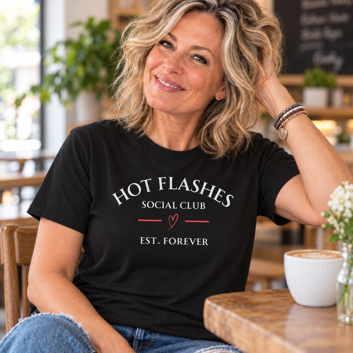 Blonde woman in her 50s wearing the Hot Flashes Est. Forever Tee