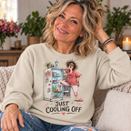 Sand — blonde woman in her 50s wearing Just Cooling Off sweatshirt