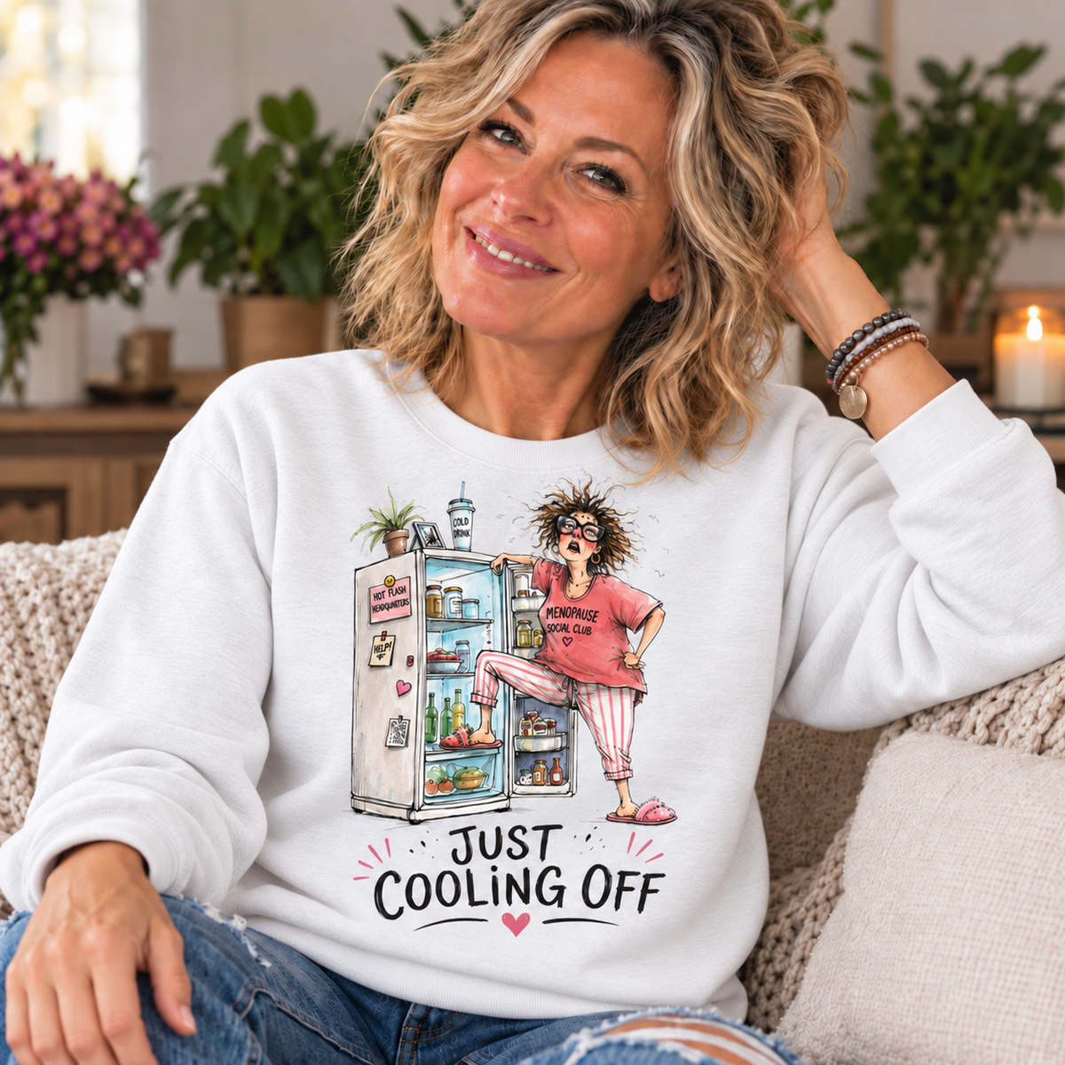 White — blonde woman in her 50s wearing Just Cooling Off sweatshirt