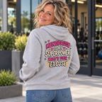 Blonde woman in her 50s wearing the Menopause Is My Superpower grey hoodie, back view