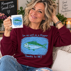 Maroon — blonde woman in her 50s wearing Wet as a Kipper sweatshirt
