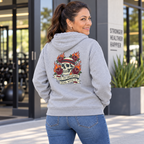 Latina woman in her 50s modelling the Yes I'm Sweating Deal With It DTF back-print hoodie
